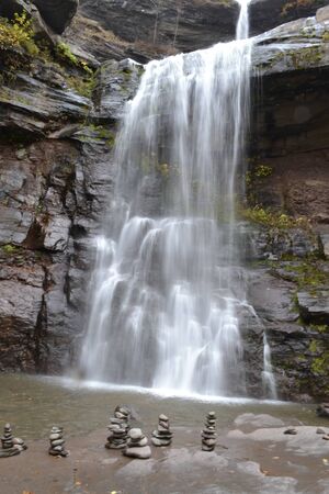 Pile of stones in front of a waterfall at the Catskill mountainの写真素材