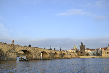 13th century bridge cruishing the Vltava riverの写真素材
