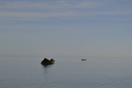 Fisherman photographed from a beach in Long Island (NY)の写真素材