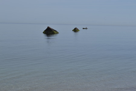Fisherman photographed from a beach in Long Island (NY)の写真素材