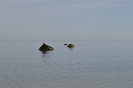 Fisherman photographed from a beach in Long Island (NY)の写真素材