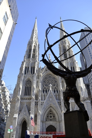 Picture from behind Atlas\' statue at the Rockefeller center with ST. Patrick\'s cathedral across the streetの写真素材