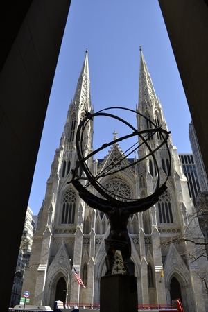 Picture from behind Atlas\' statue at the Rockefeller center with ST. Patrick\'s cathedral across the streetの写真素材