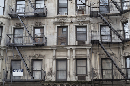 Characteristic fire escape that can be found in many areas of NYCの写真素材