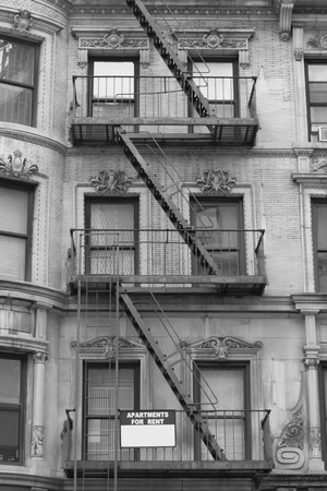 Characteristic fire escape that can be found in many areas of NYCの写真素材
