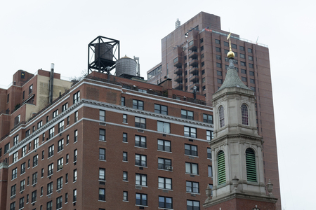 Water tower are iconic in NYC and their function is the distribution of potable water and providing emergency storage for fire protectionの写真素材