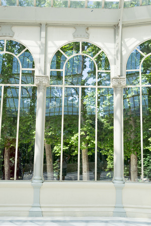 The Crystal Palace is located in the heart of the buen retiro park in Madrid in front of a lakeのeditorial素材