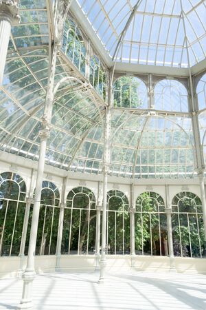 The Crystal Palace is located in the heart of the buen retiro park in Madrid in front of a lakeのeditorial素材