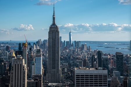 NYCs lower Manhattan with the Empire State Building from a high up point in Midtownの写真素材