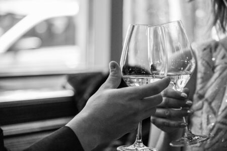 Glasses of rose wine ready for a toast to celebrate a weddingの写真素材