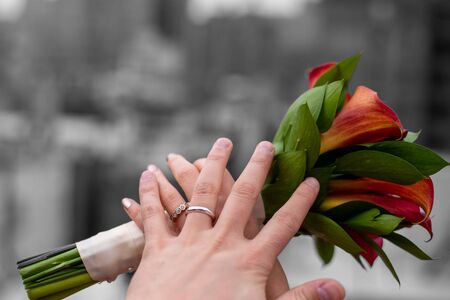 Hands of a newly married couple showing their rings in a roof top in the Upper East side of Manhattan (NYC, USA)の写真素材