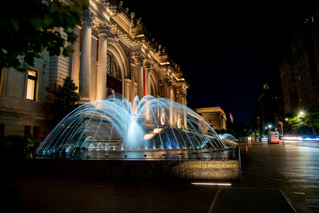 Facade and fountain of the Metropolitan museum of art at night in NYCのeditorial素材