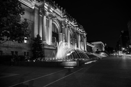 Facade and fountain of the Metropolitan museum of art at night in NYCのeditorial素材