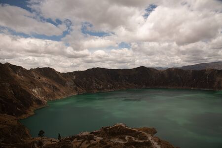Panorama of the Quilotoa volcano with its water-filled caldera (Ecuador)の写真素材