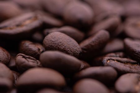 Macro photograph of coffee beans on top of a pileの写真素材