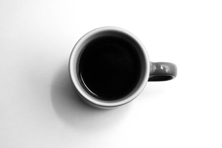 Blue porcelain cup filled with coffeeの写真素材