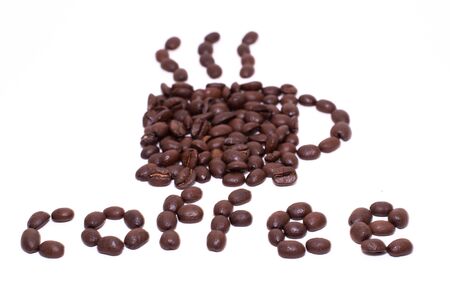 Cup of coffee shape and the word coffee created with coffee beans over a white backgroundの写真素材