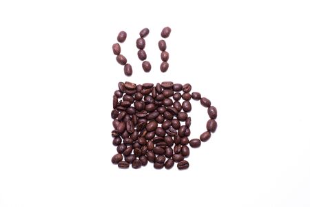 Cup of coffee shape created with coffee beans over a white backgroundの写真素材