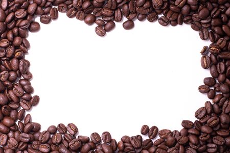 Square frame formed by coffee beans over a white backgroundの写真素材