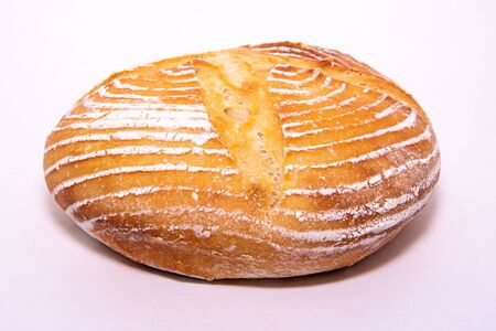 Home baked sourdough loaf on a whithe background