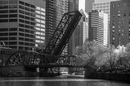 One of the many bridges that crosses the river in Chicagoの写真素材