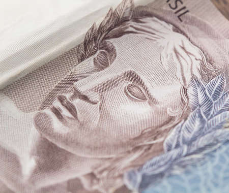 Money, Brazil, Money, Real, Reais. Real currency, money from Brazil. Brazilian banknotes and coins on a white surface. Banknotes of 200 reais and 50 reais.の写真素材