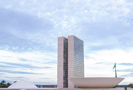 The National Congress of Brazil. Building designed by Oscar niemeyer. It is composed in the Chamber of Deputies and the Federal Senate. Brasilia, Federal District - Brazil. December, 12, 2020.のeditorial素材