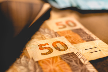 Real currency (BRL) - Money from Brazil. Money, Reais, Brazilian Real, Brazil. Brazilian banknotes in close up on a desk.の写真素材
