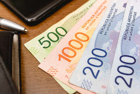 Pesos banknotes in money close-up of argetina's currency, the Argentine peso. Photo for...