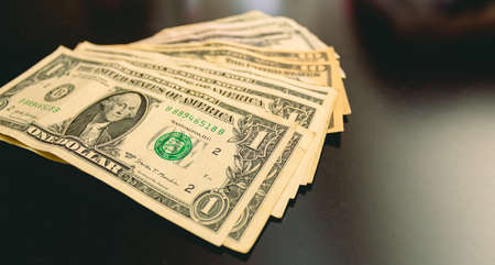 Dollars on a black background. Selective focus. Money.の写真素材