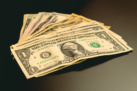Dollars banknotes on a black background. American money.