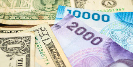 Close up view of the US dollar and Japanese yen banknotes.