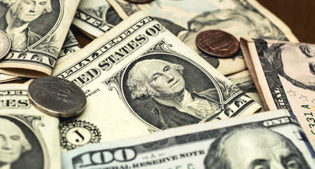 American dollar bills and coins as background, closeup. Business concept