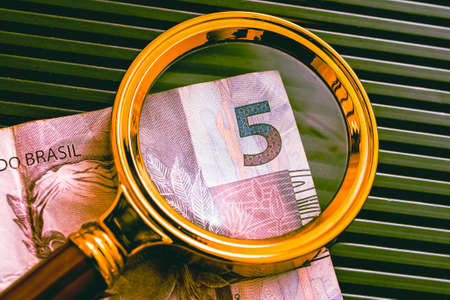 A magnifying glass and banknote of five thousand rubles.の写真素材