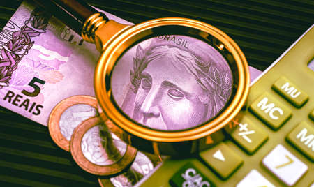 Money and magnifying glass. Business and finance concept. Close upの写真素材