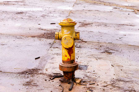 Old rusty fire hydrant on the street.の写真素材
