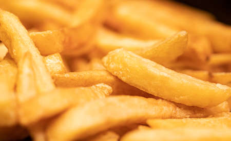 Golden French fries potatoes ready to be eaten. Selective focus.の写真素材
