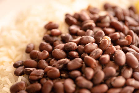 Close up of brown beans and rice on a plate. Selective focus.の写真素材