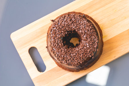 Chocolate cake on wood plate with copy space, top view.の写真素材