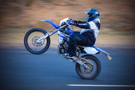Motorbike wheelie on road at high speedsのeditorial素材