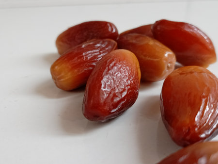 Date fruits on a white background. Close-up of dates.
