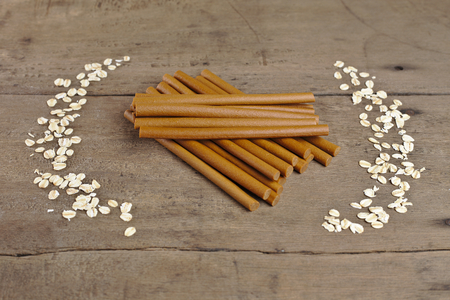 stick bone on wooden background. it is snack for dogの写真素材