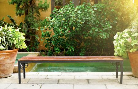 the bench along the waterfront on a nice spring day in the morning lightの写真素材