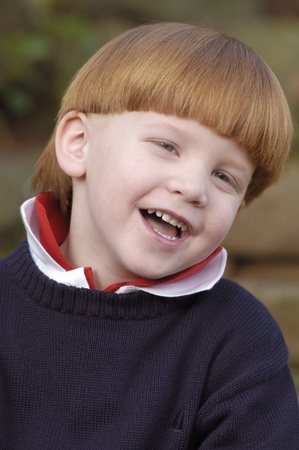 Portrait of young red haired boy