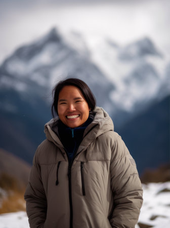 Asian woman with snow mountain background in Himalayas, Nepal.の素材