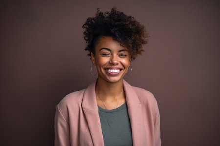 Portrait of a beautiful african american woman smiling at cameraの素材