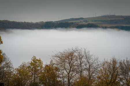 Landscape in Germany foggy view down a hill to a valley