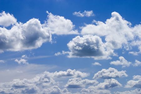 White fluffy clouds and blue sky