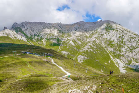 01_Wide panorama to Latemar Group- 2846 m and Chalet Torre di Pisa, Dolomiti Italy.の写真素材