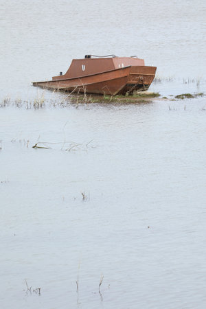 A boat appears to be stranded, but it's actually a play ground which has been flooded by the river IJsselの写真素材